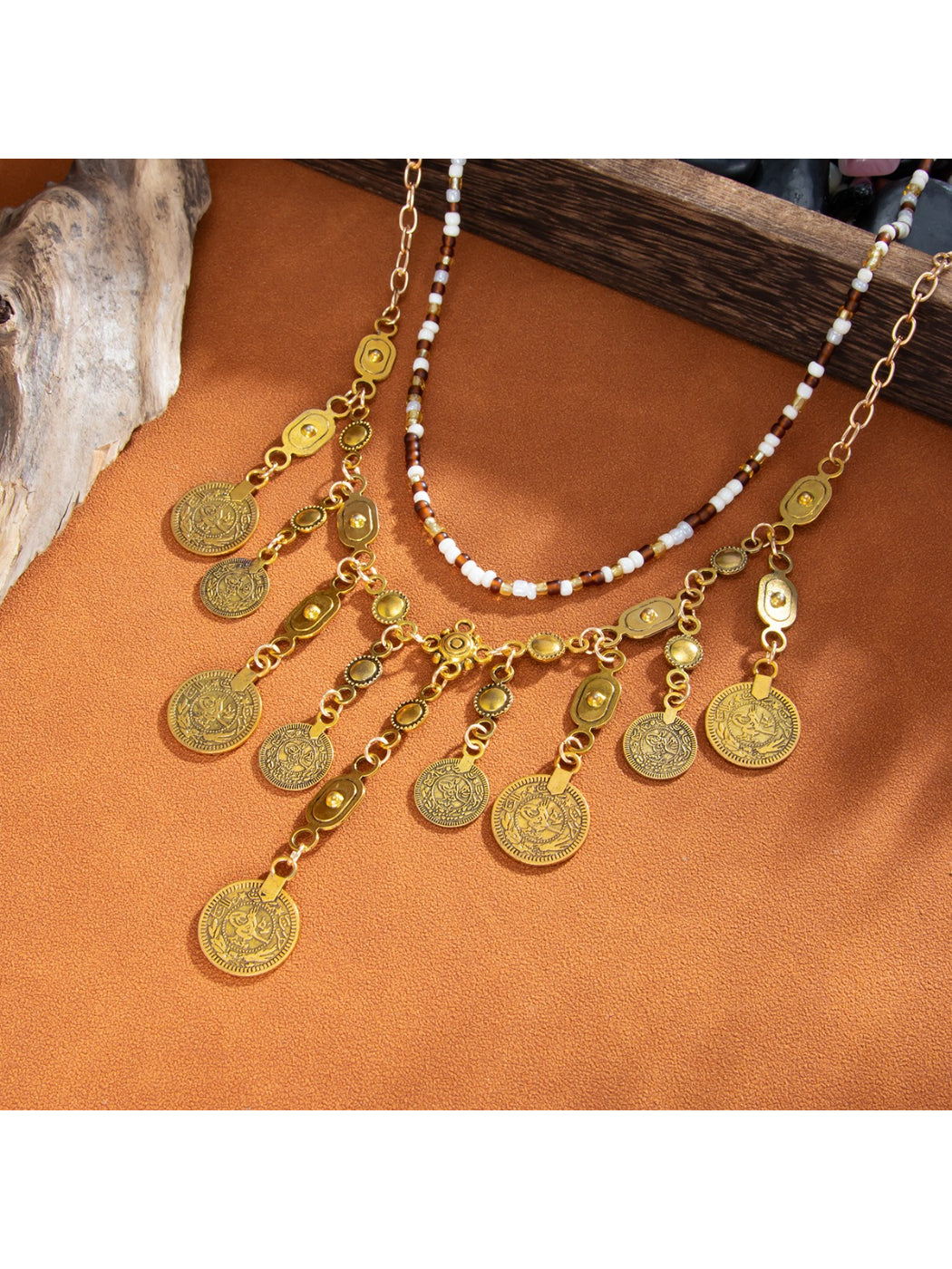 Boho coin pendant necklace displayed with matching boho accessories