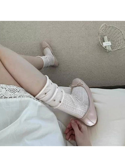 Pair of Rufia ruffle mesh dot mid-calf socks shown from above highlighting dot pattern