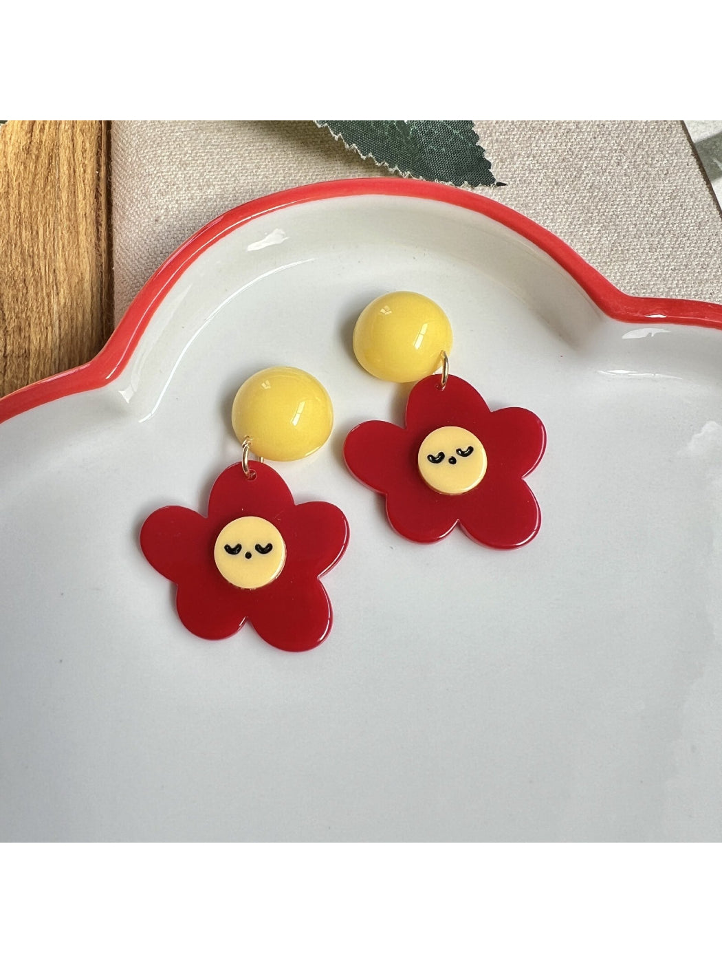 Close-up of Earwish Smiley Flower Drop Earrings showing detailed flower charm
