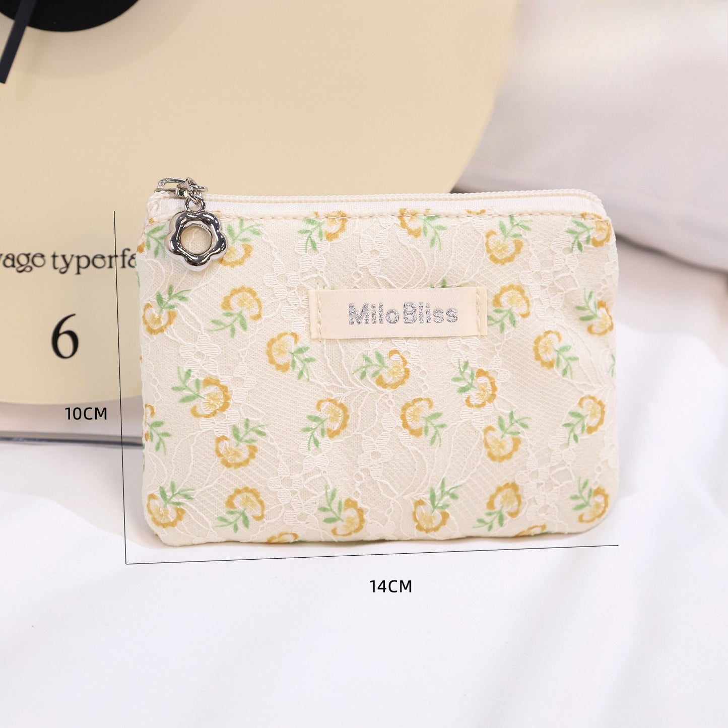 Cosbai floral coin purse with bright flower motifs and rounded shape