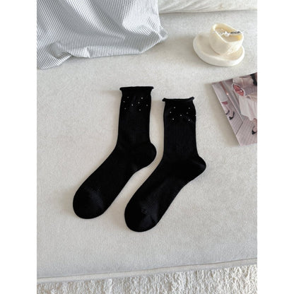 Model wearing Rufia Everyday Turn Cuff Knit Socks with rolled cuff and casual outfit
