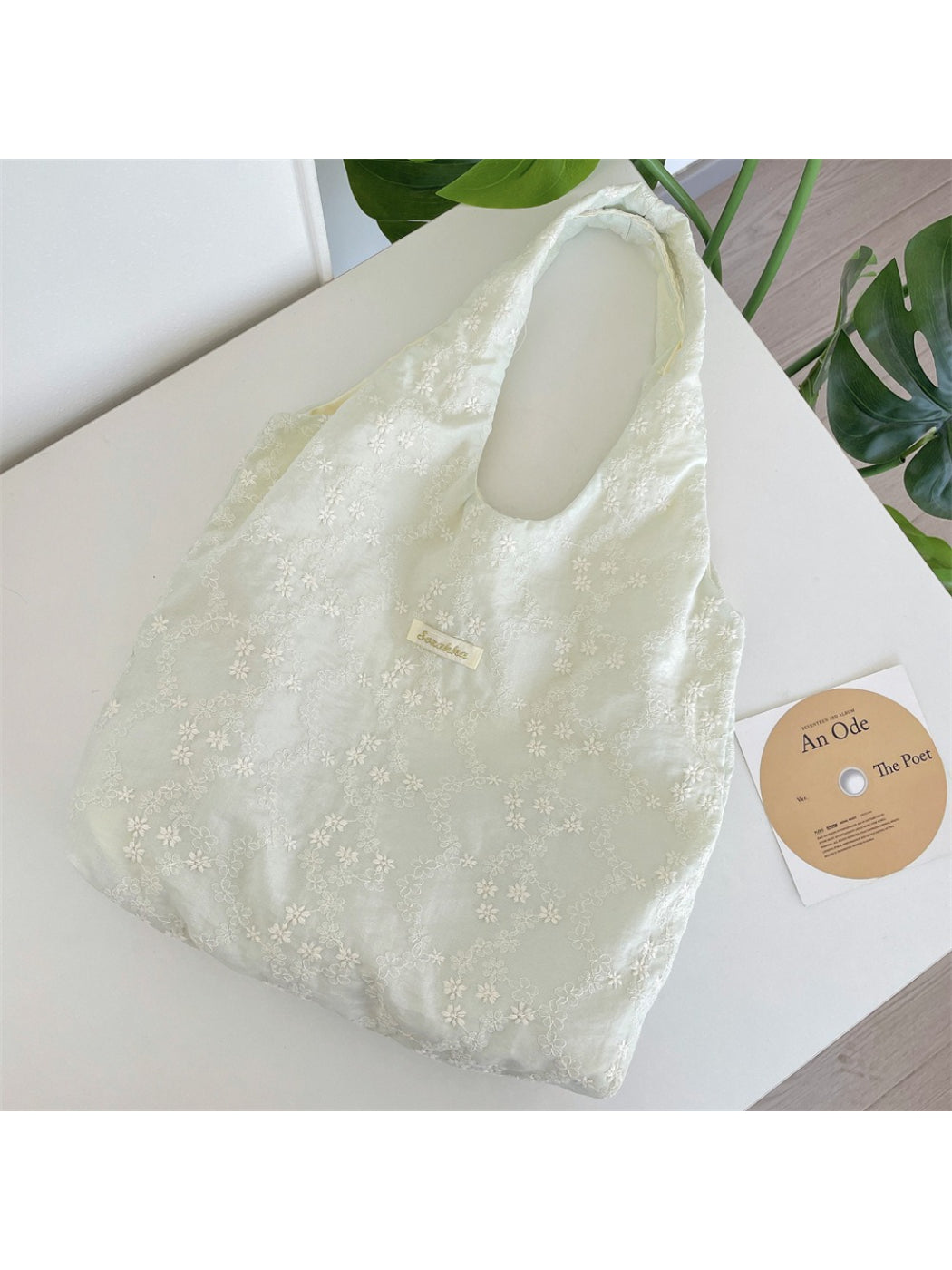 Side view of Cosbai Soft Daisy Shoulder Tote Bag highlighting soft fabric and stitching