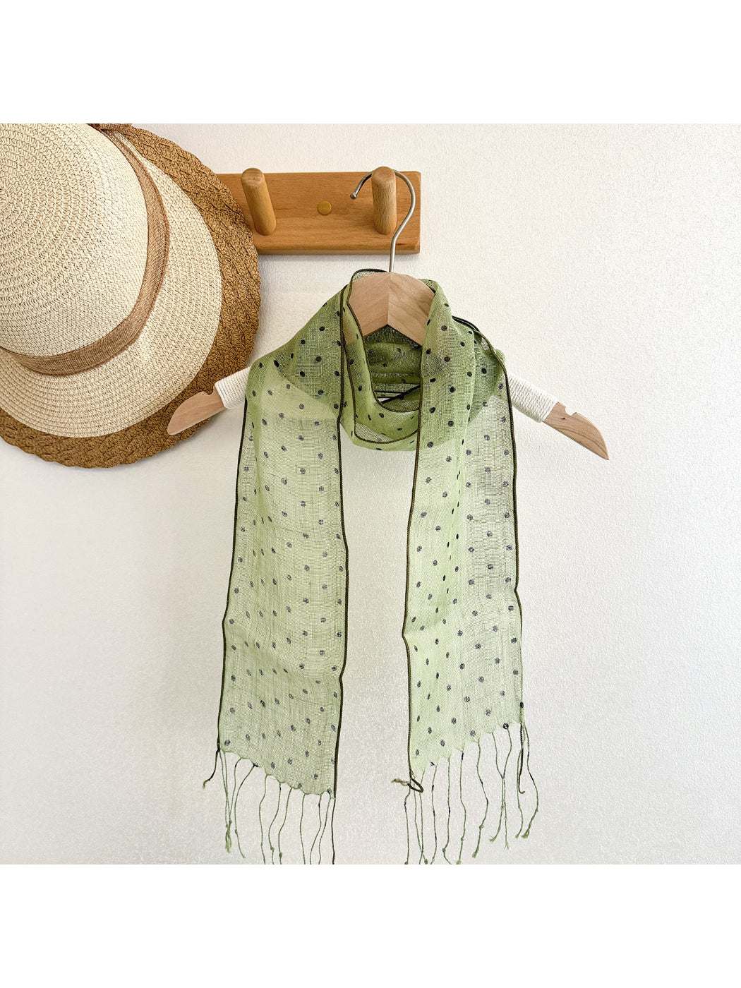 Close-up of Scarvii polka dot scarf fabric texture and pattern