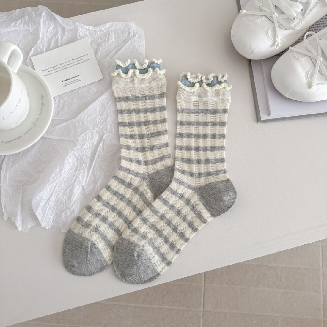 Rufia crew socks displayed flat highlighting knit texture and length