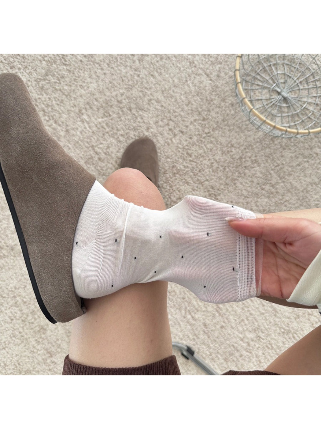 Rufia soft polka mesh socks worn with black shoes and cropped pants