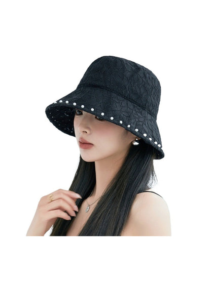 Model wearing Haila floral lace bucket hat paired with casual outfit outdoors