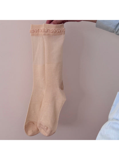 Model wearing Rufia Loop Trim Ribbed Crew Socks with casual shoes
