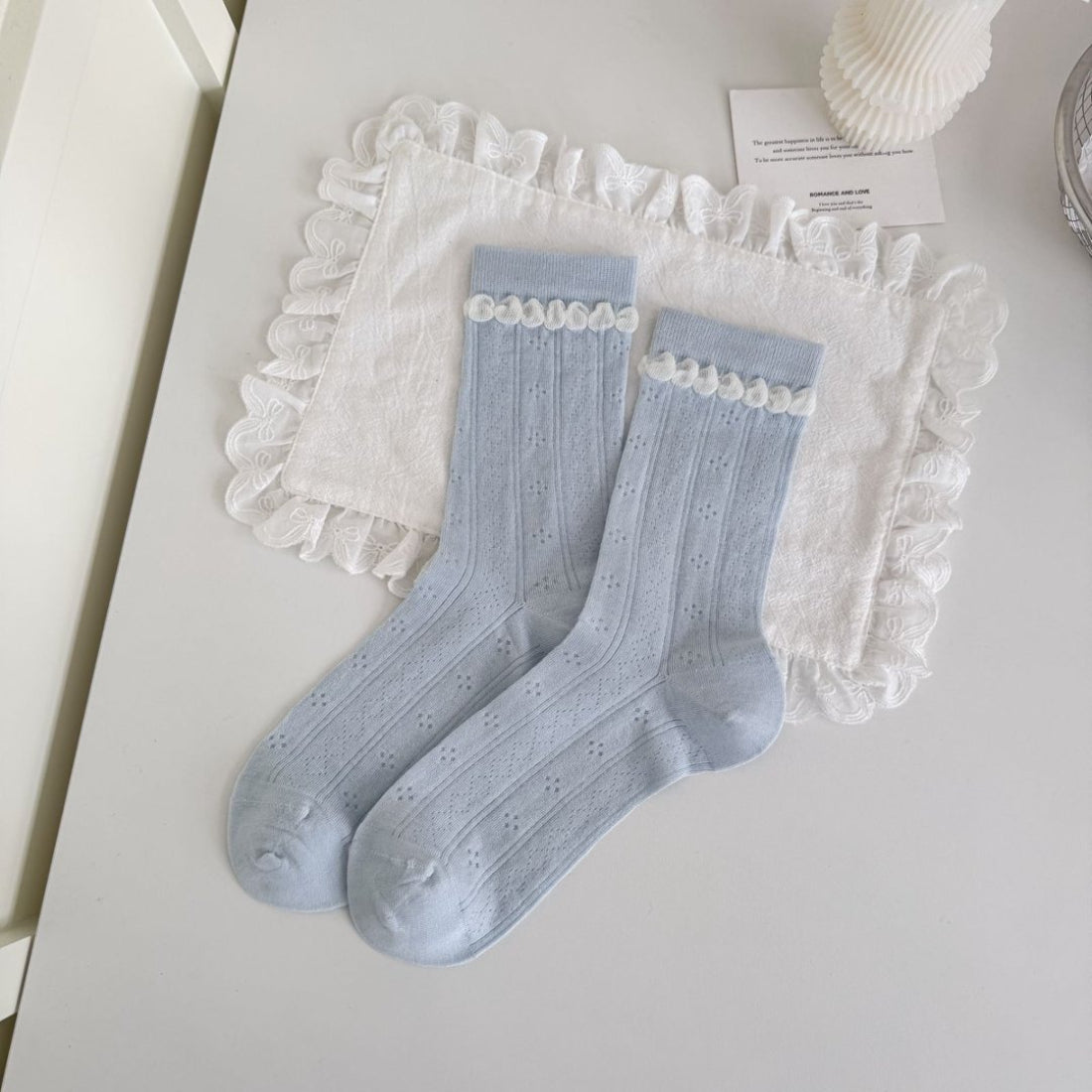 Rufia blue tone crew socks displayed with product packaging