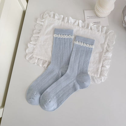 Rufia blue tone crew socks displayed with product packaging