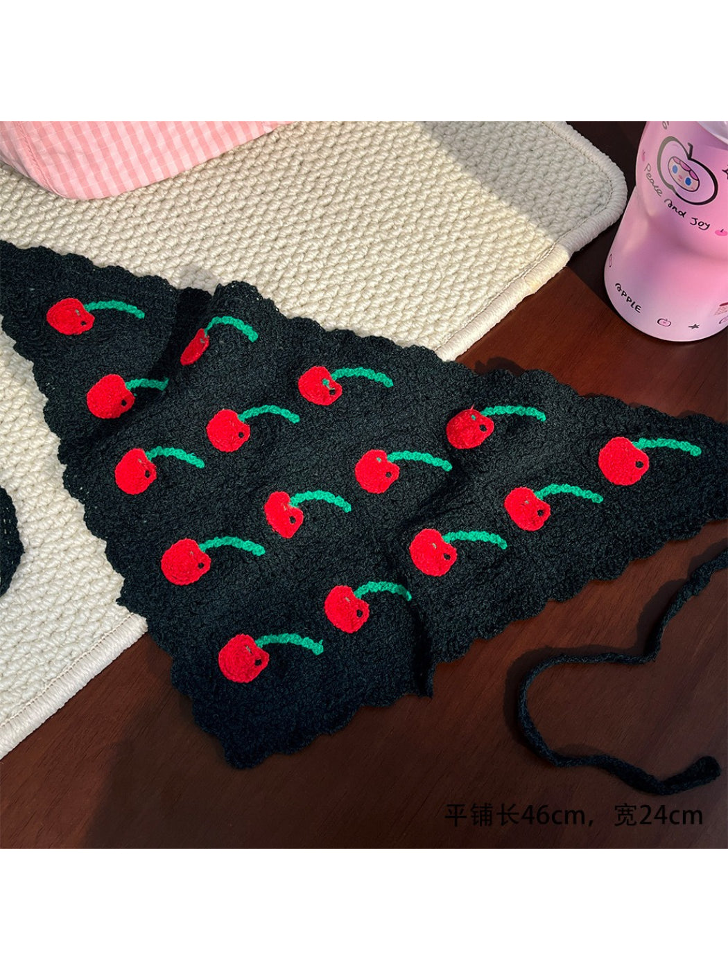 Close-up of Scarvii crochet headband showing detailed fruit pattern and textured yarn