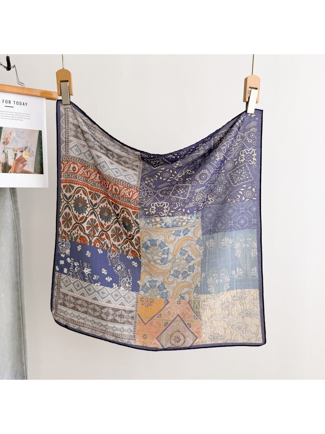 Scarvii scarf folded with visible intricate patchwork details
