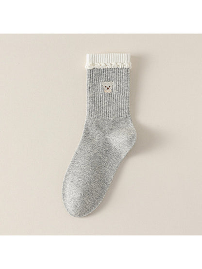 Rufia soft teddy detail ribbed socks displayed on wooden surface