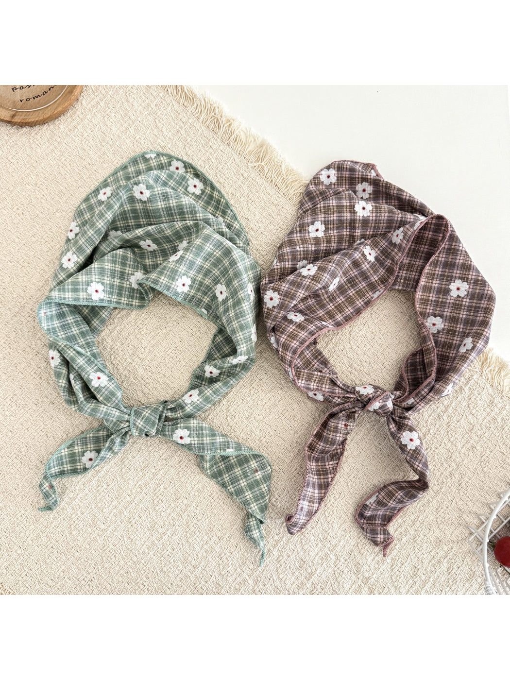 Soft plaid hair tie scarf with daisy pattern in pastel colors tied in a bow