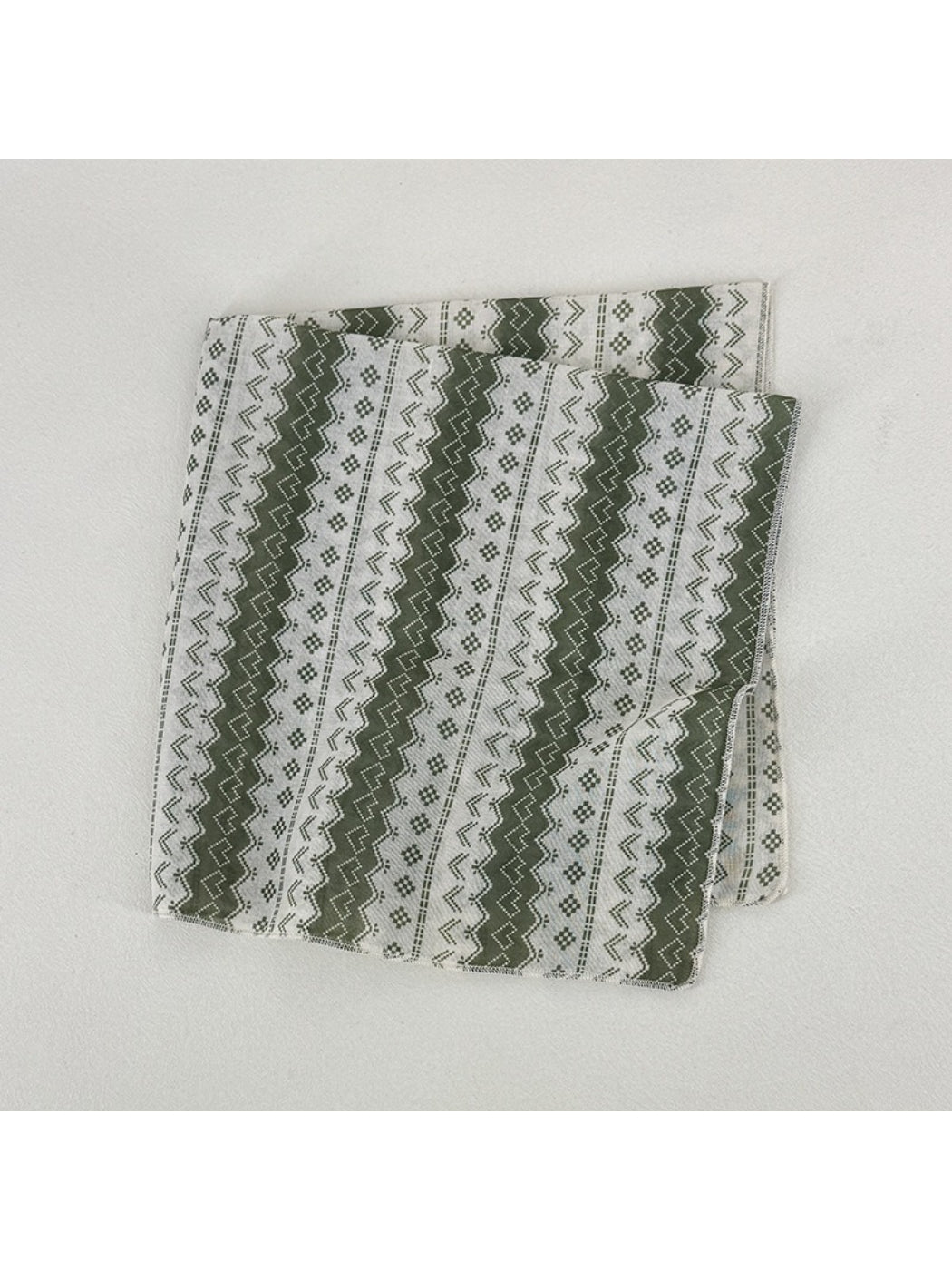 Scarvii geometric pattern scarf draped over shoulder showcasing fabric texture and colors