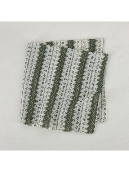 Scarvii geometric pattern scarf draped over shoulder showcasing fabric texture and colors