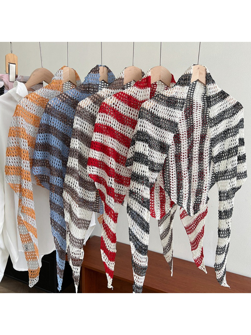 Scarvii open knit striped triangle scarf in neutral tones displayed flat