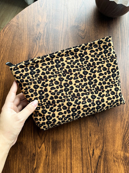 Side angle of Cosbai leopard print flat pouch highlighting slim profile