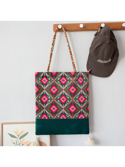 Cosbai Boho Ethnic Tassel Tote bag with ethnic design and tassels displayed on table