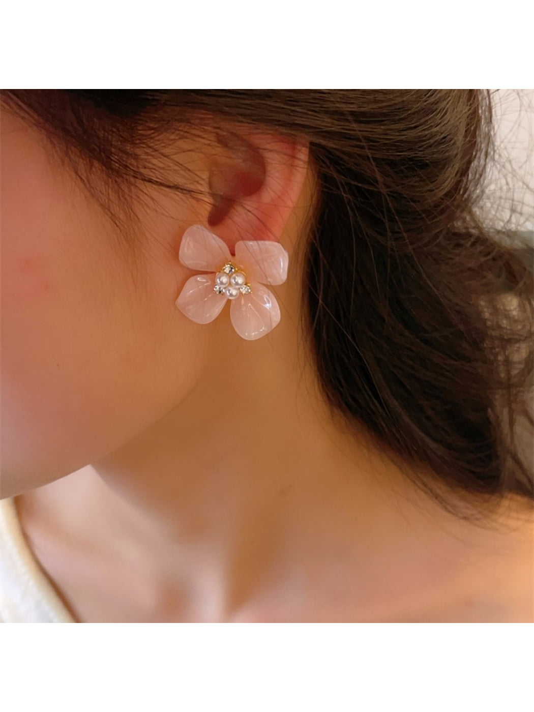 Earwish Rounded Petal Bloom Earrings displayed on a jewelry stand with soft lighting