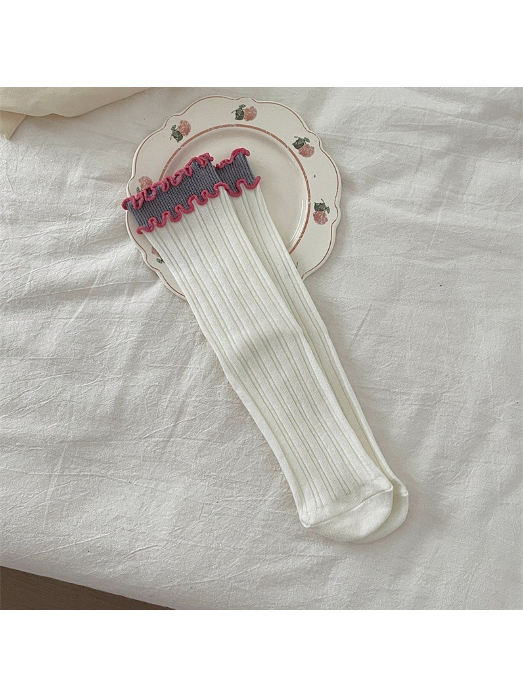 Rufia ruffle color block crew socks laid out with visible ruffle detail and color blocks
