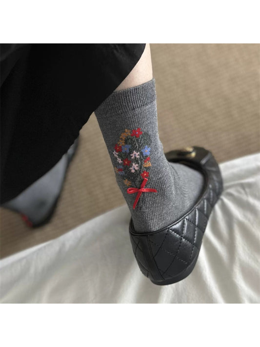 Rufia floral bow ankle socks displayed flat showing floral knit pattern