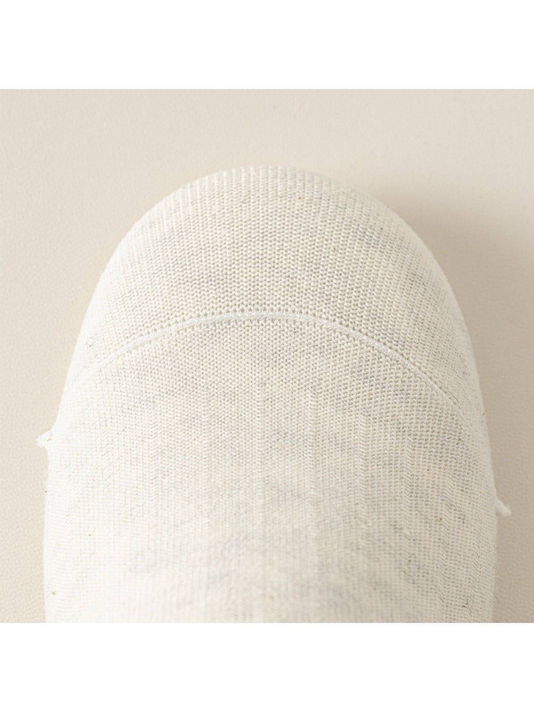 Model wearing light gray Rufia ribbed mid-calf socks paired with sneakers