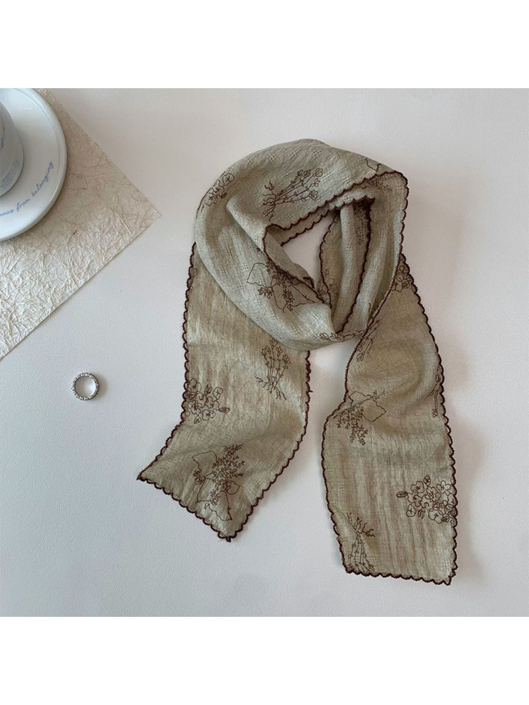 Scarvii Floral Stitch Narrow Scarf draped over a mannequin showcasing length and pattern
