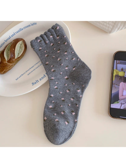 Rufia Tiny Blossom crew socks displayed flat highlighting soft fabric and blossom print