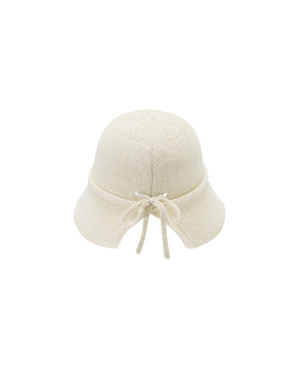 Haila tie back woven bucket hat shown from above on a flat surface