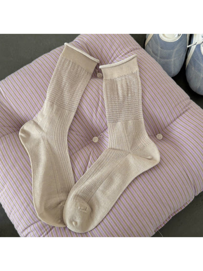 Model wearing Rufia soft knit everyday crew socks with rolled-up pants