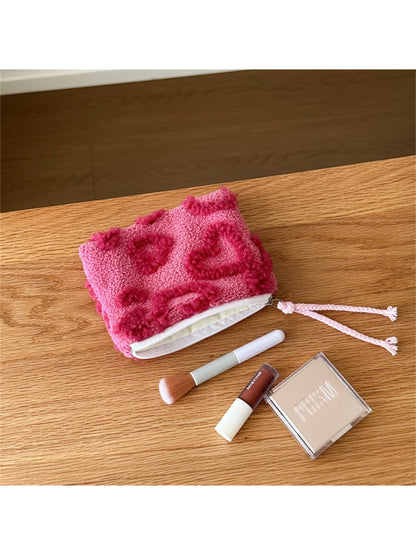 Side view of the small plush heart gift pouch detail