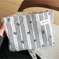 Cosbai gingham bow makeup pouch displayed on a white surface