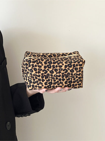 Cosbai travel makeup bag displayed with matching leopard print accessories
