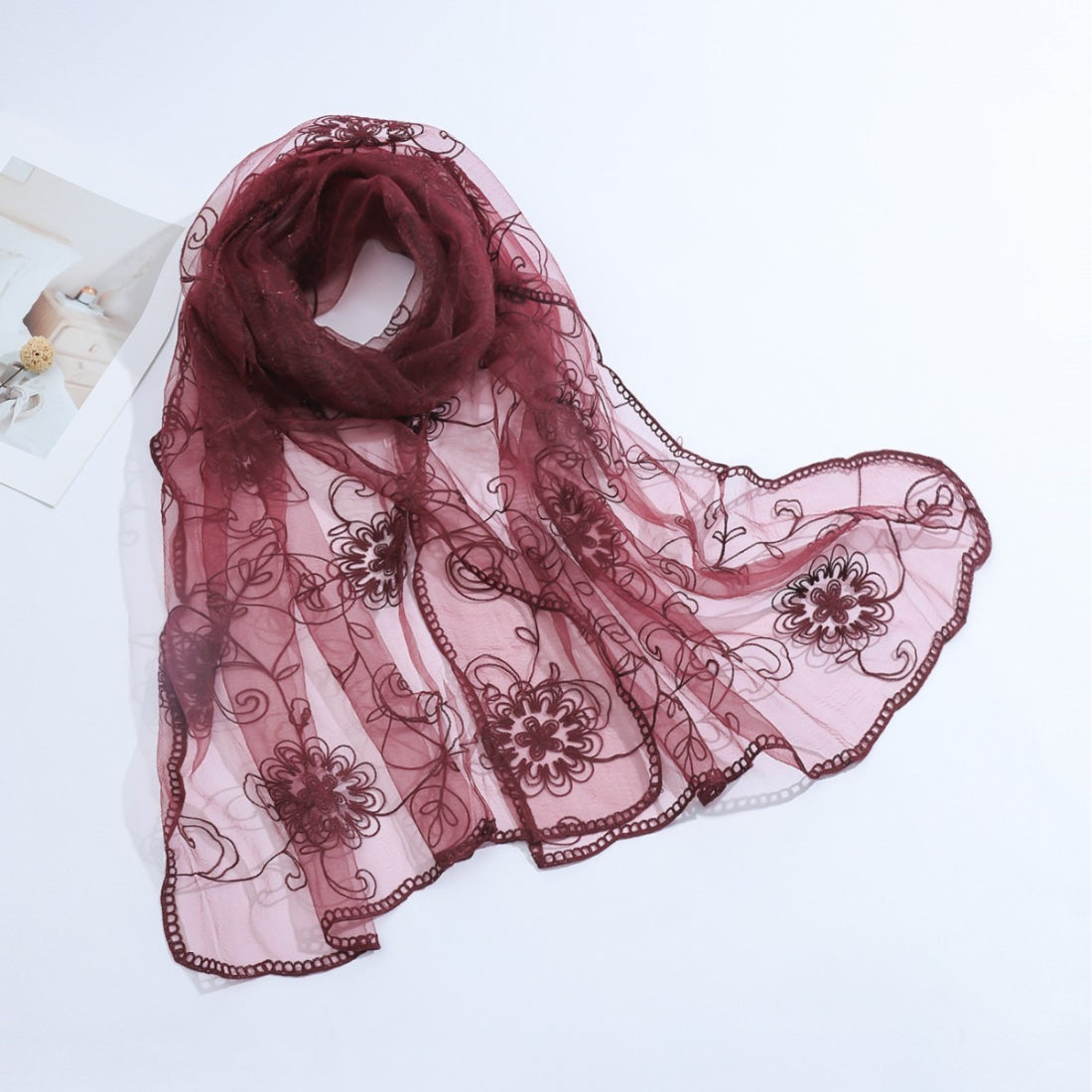 Scarvii floral mesh scarf loosely wrapped on a mannequin bust