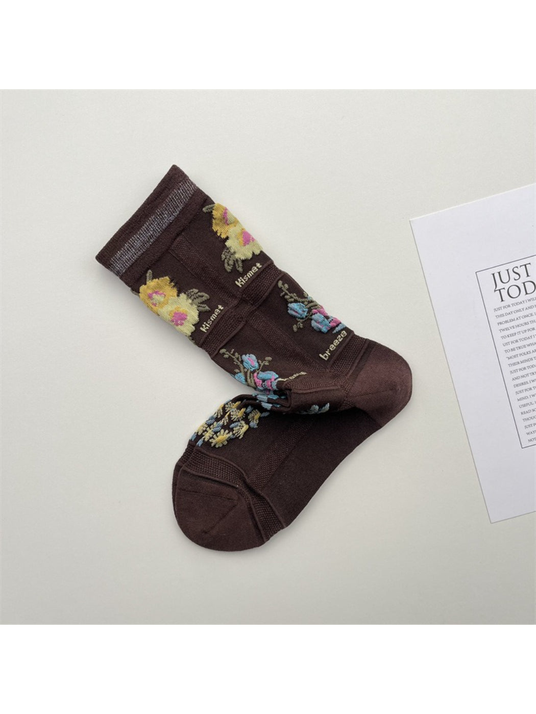 Side view of Rufia mesh floral mid-calf socks worn on feet with visible floral mesh design