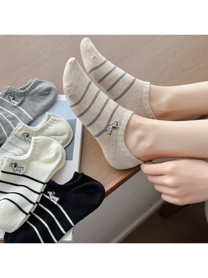 Pair of Rufia Dog Stripe No Show Socks in white with black dog stripe pattern