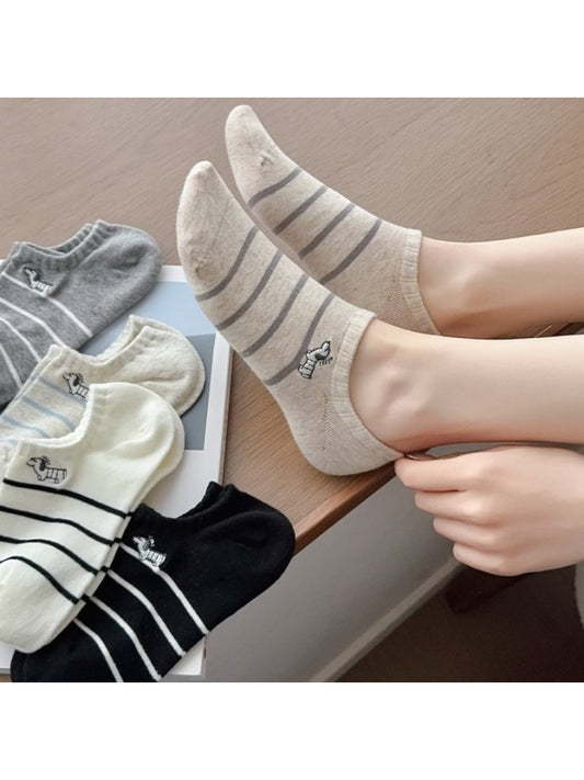 Pair of Rufia Dog Stripe No Show Socks in white with black dog stripe pattern