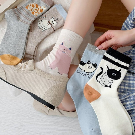 Pair of Rufia novelty cat knit crew socks in white with colorful cat faces