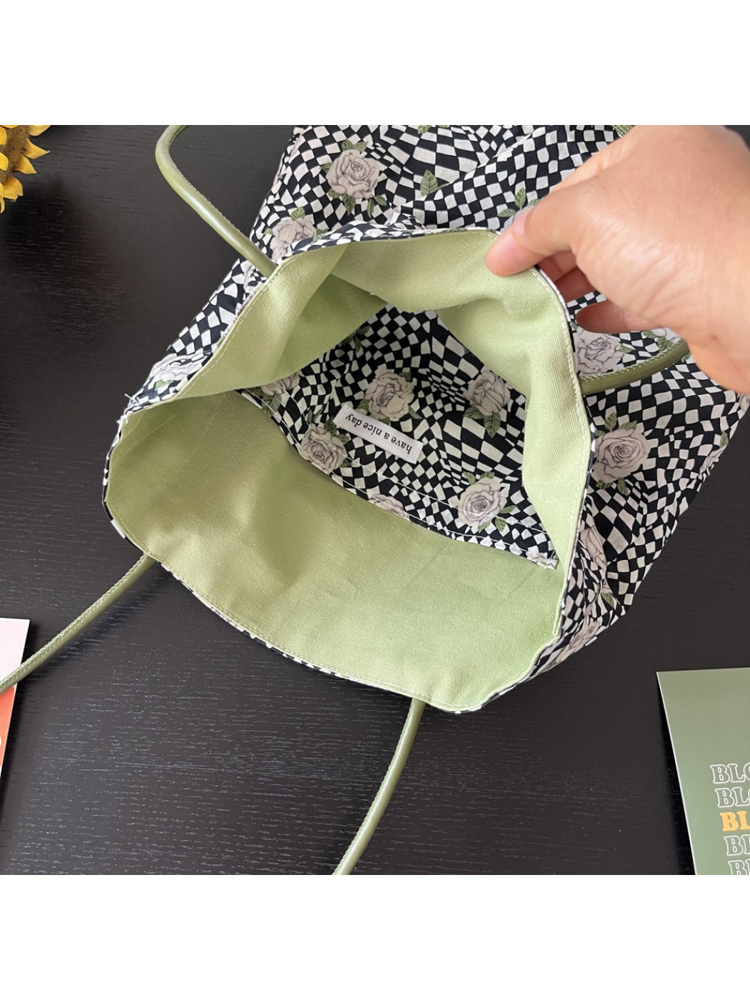 Side view of Cosbai Checker Rose Drawstring Bag highlighting drawstring straps