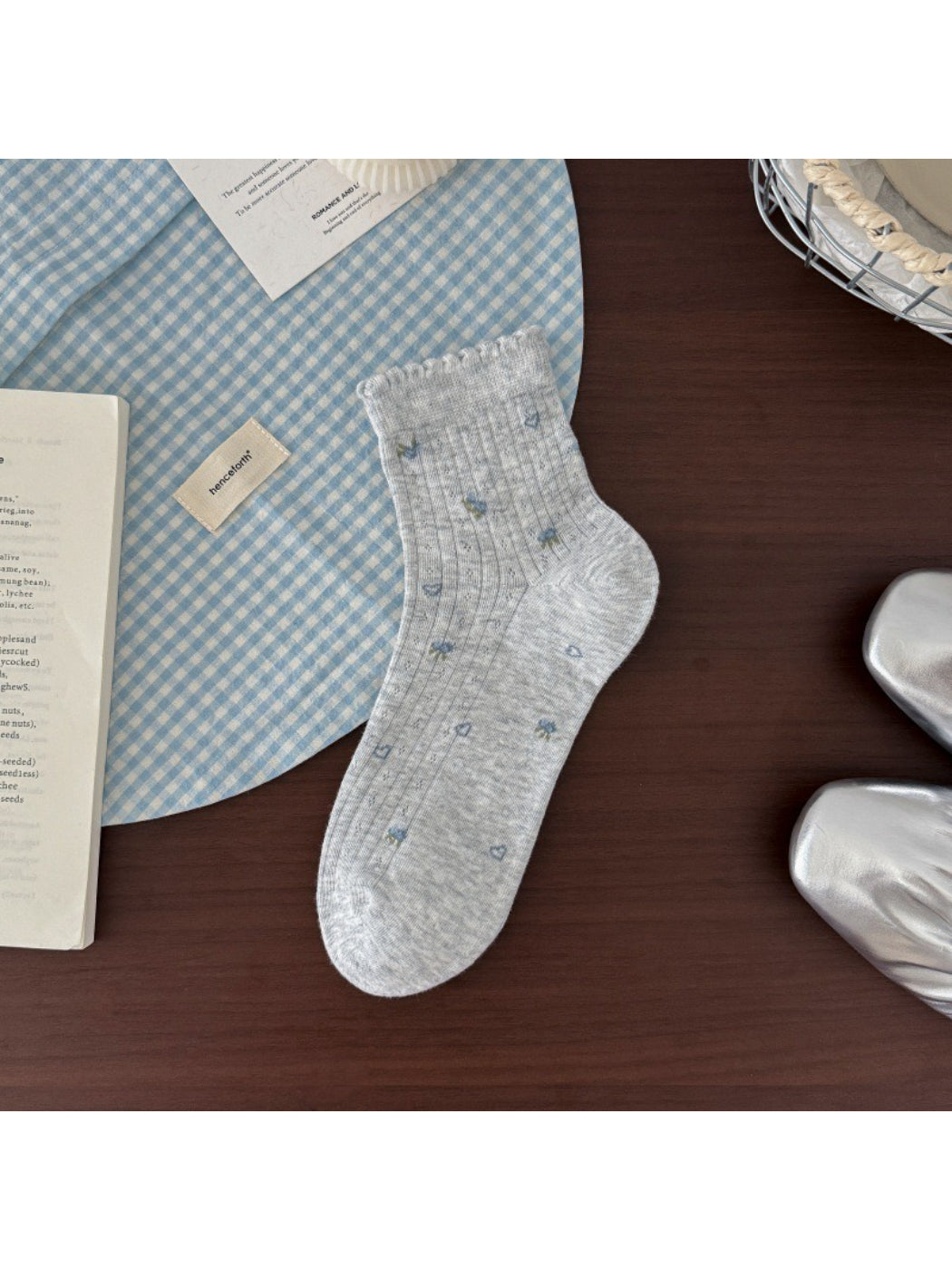 Rufia sheer ruffle hem crew socks displayed with folded ruffle detail visible