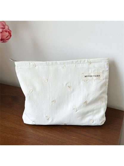Top view of the Cosbai makeup organizer bag partially open
