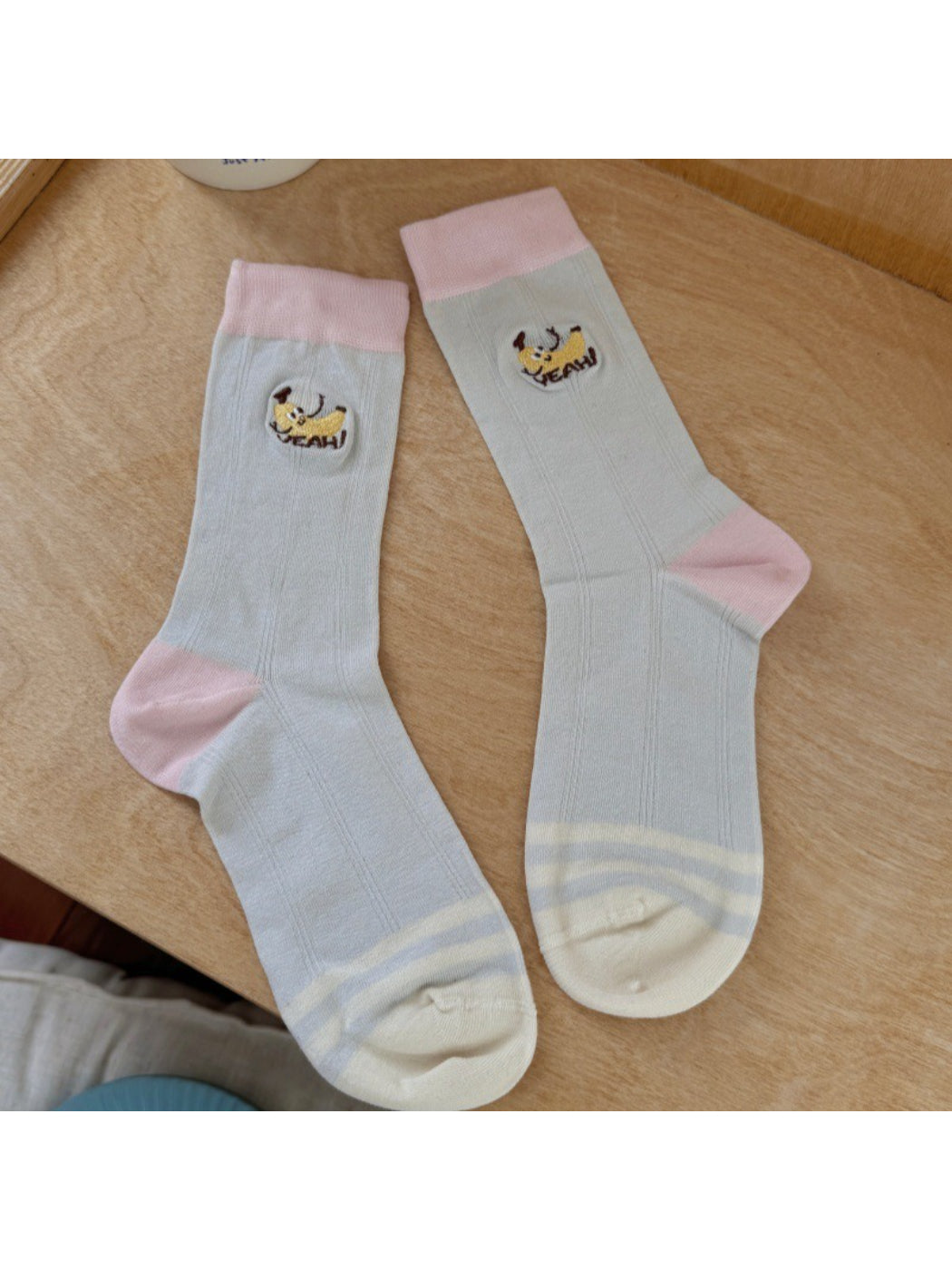 Rufia socks folded neatly with visible fruit illustrations