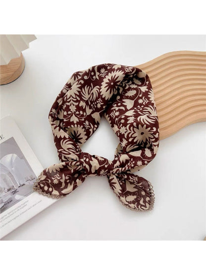 Scarvii Ornate Botanical Square Scarf styled as a headscarf featuring vibrant floral design