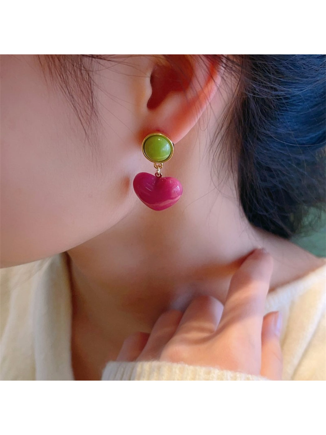 Side view of Color Pop Heart Drop Earrings highlighting the drop length and clasp