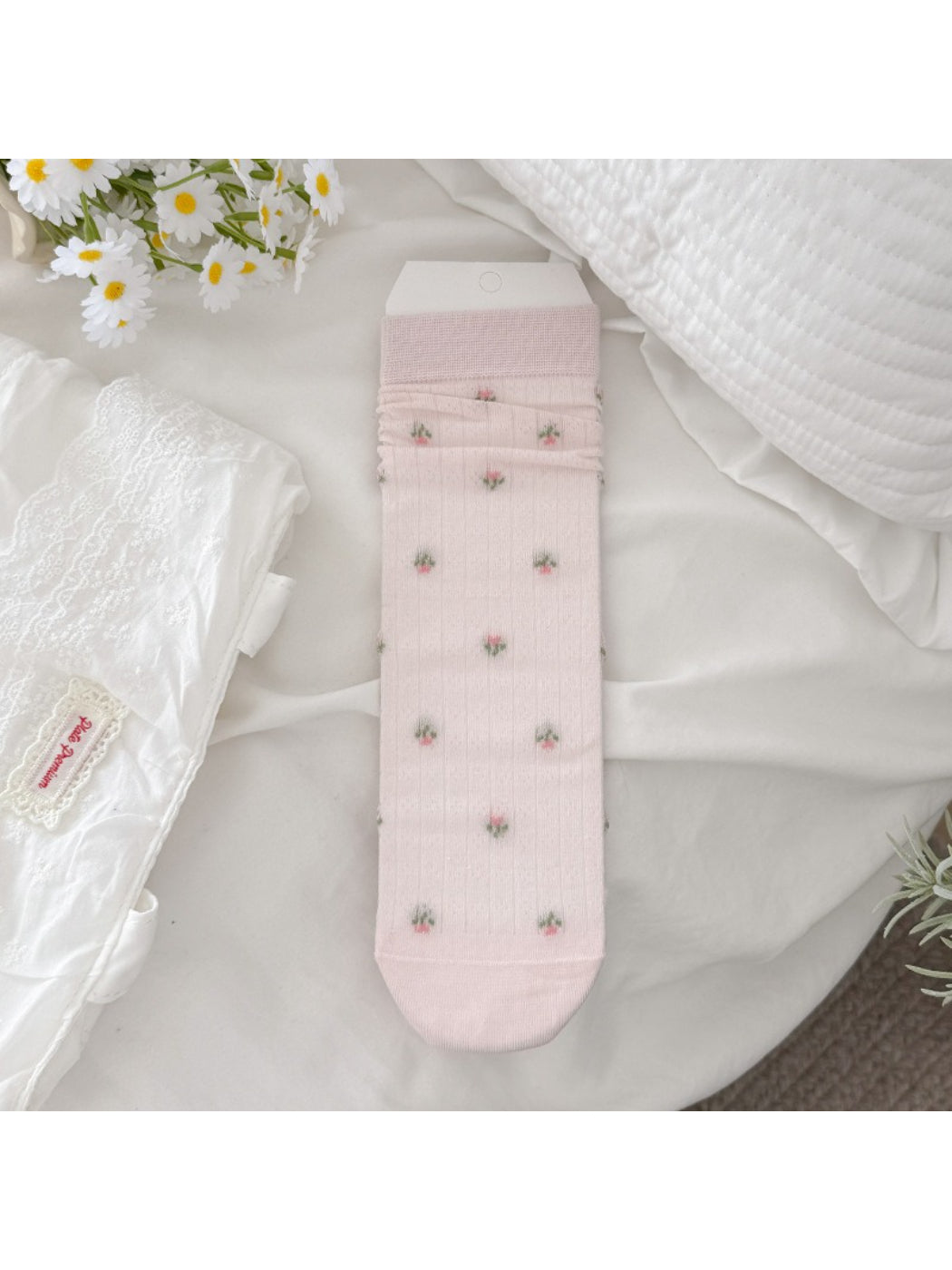 Rufia socks folded to show floral pattern and ribbed fabric detail