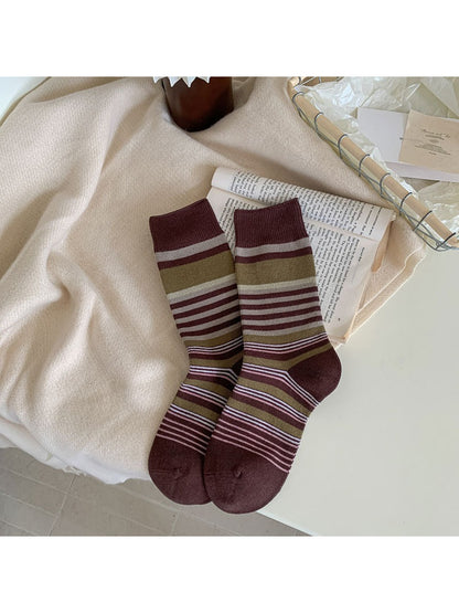 Side view of Rufia socks showing bow pattern and ribbed cuff