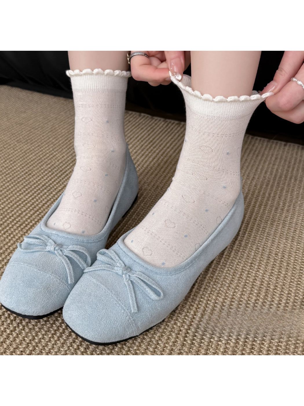 Model wearing Rufia sheer ruffle hem crew socks with white sneakers