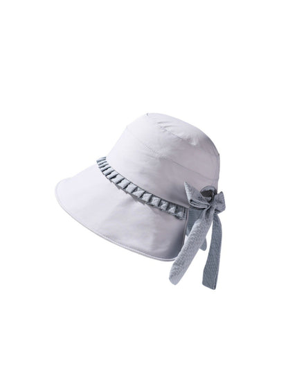 Model wearing Haila tie back summer hat outdoors with casual outfit