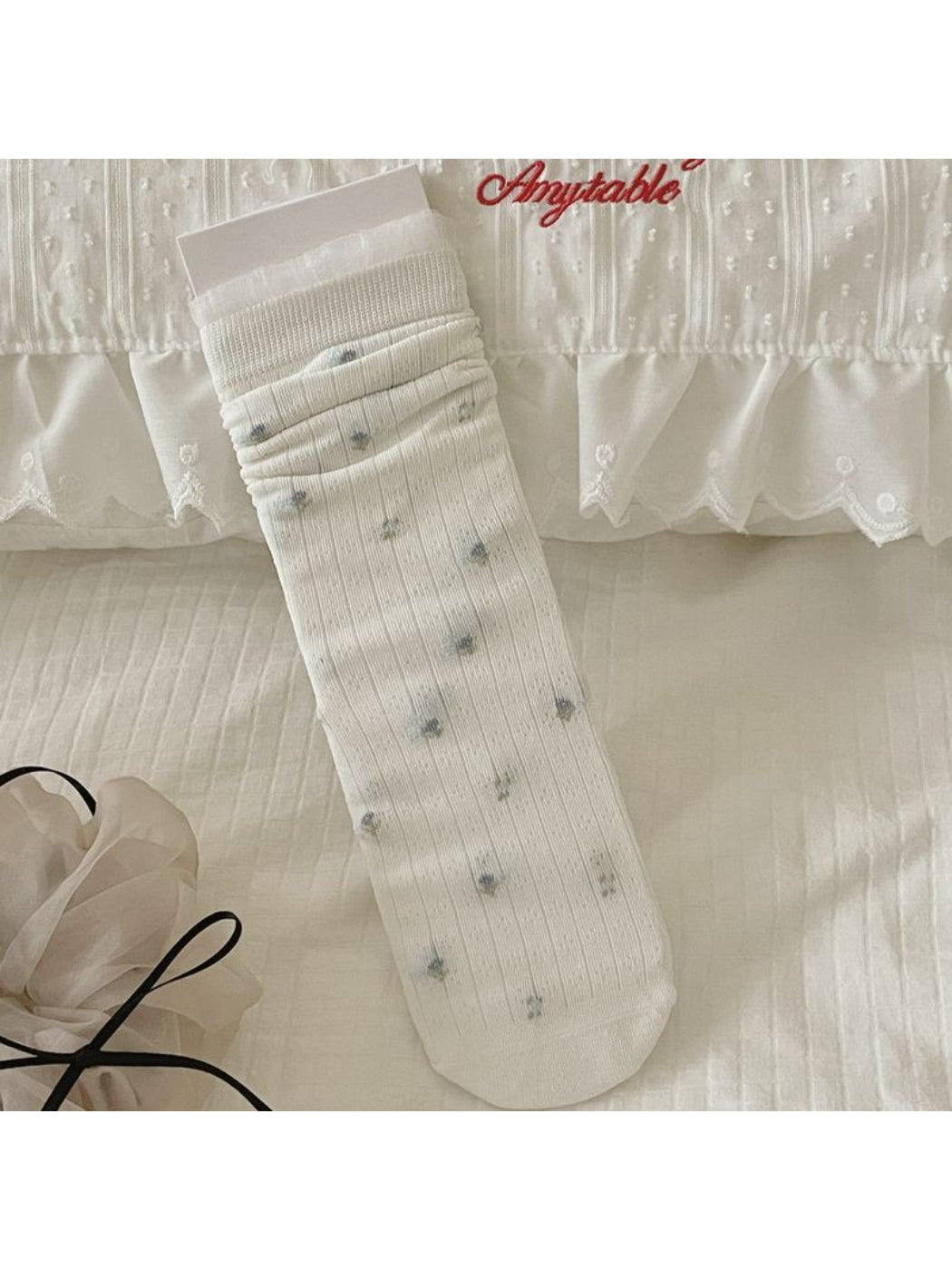 Model wearing Rufia Ditsy Bow Ribbed Crew Socks with casual shoes