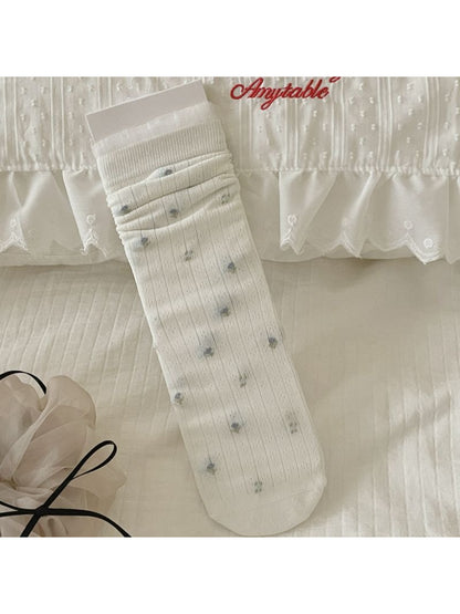 Model wearing Rufia Ditsy Bow Ribbed Crew Socks with casual shoes